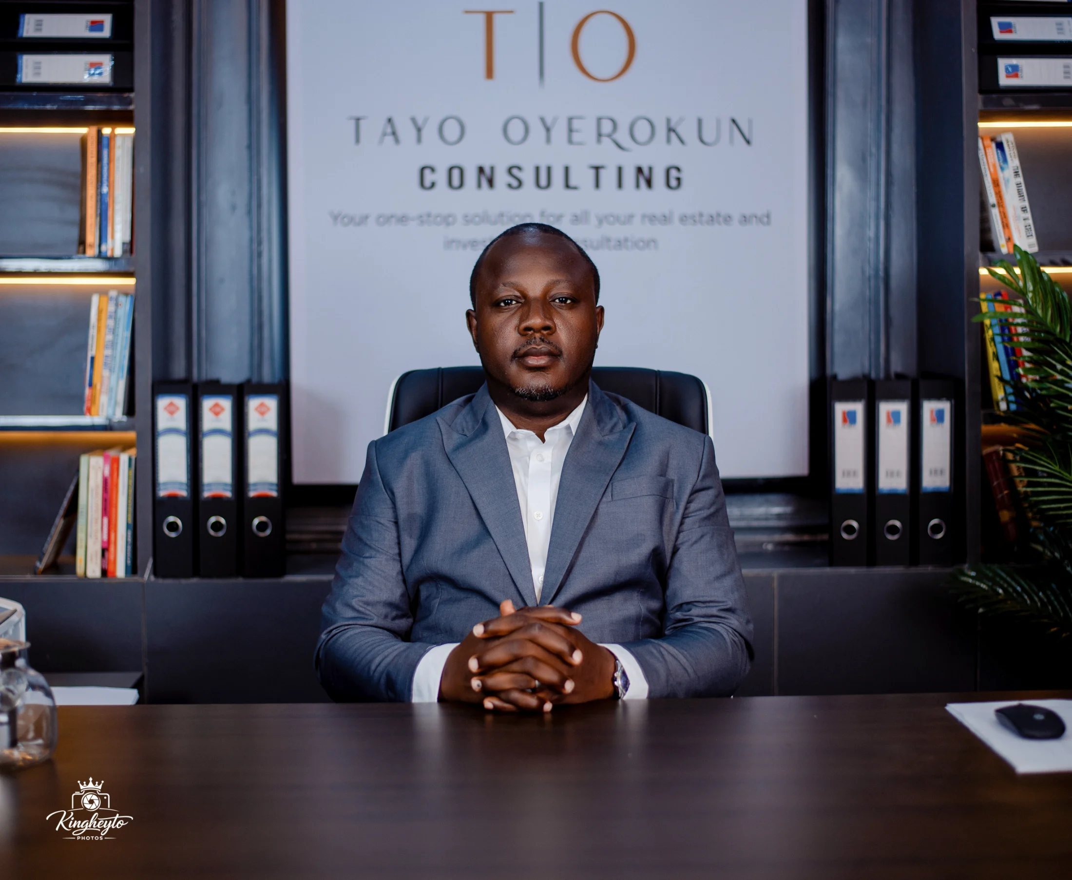 Engr. Omotayo Oyerokun, Principal Partner and Lead Consultant, seated at his office desk